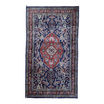 Vintage rug decorated with stylized plant motifs on a blue and terracotta background 160 x 90 cm mecha rug