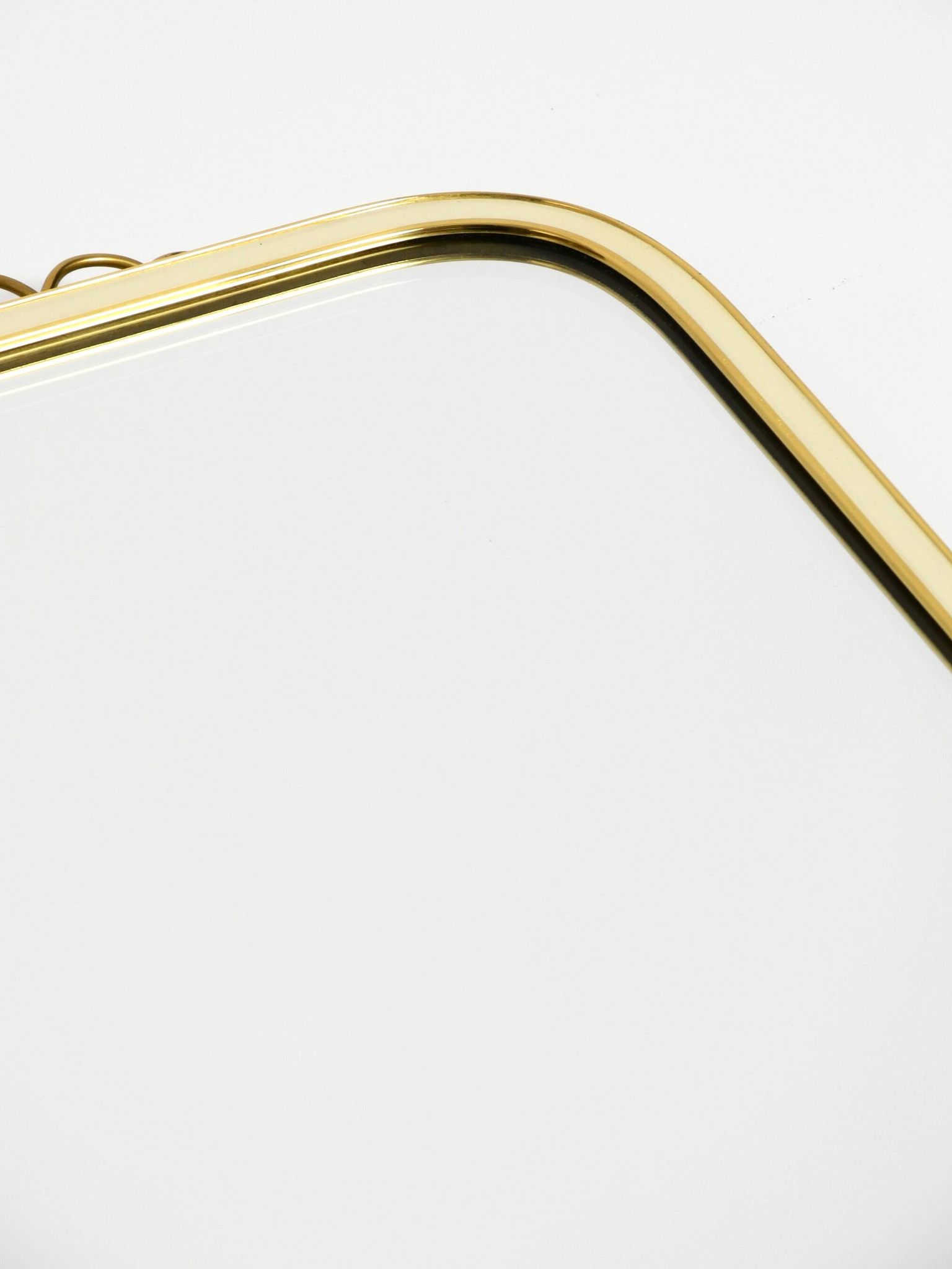 Large heavy long Mid Century brass wall mirror by Münchner Zierspiegel