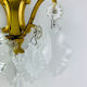 Bronze wall light with rococo style Louis XV pendants.
