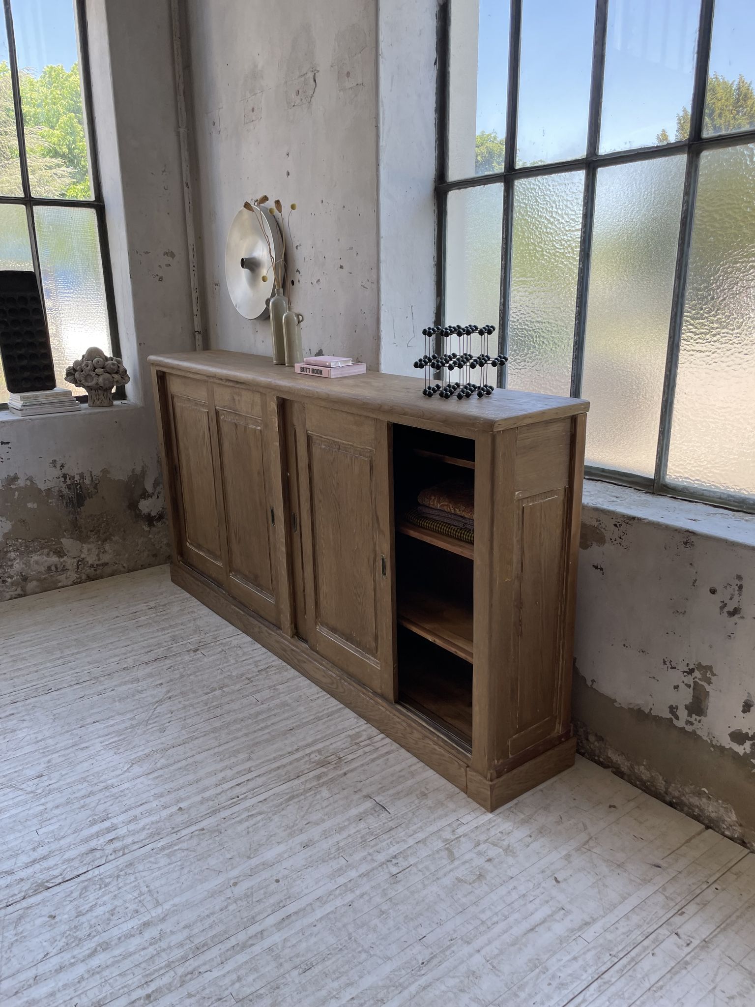 Large row of solid oak loom sliding doors