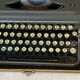 Triumph perfekt typewriter with its transport box.