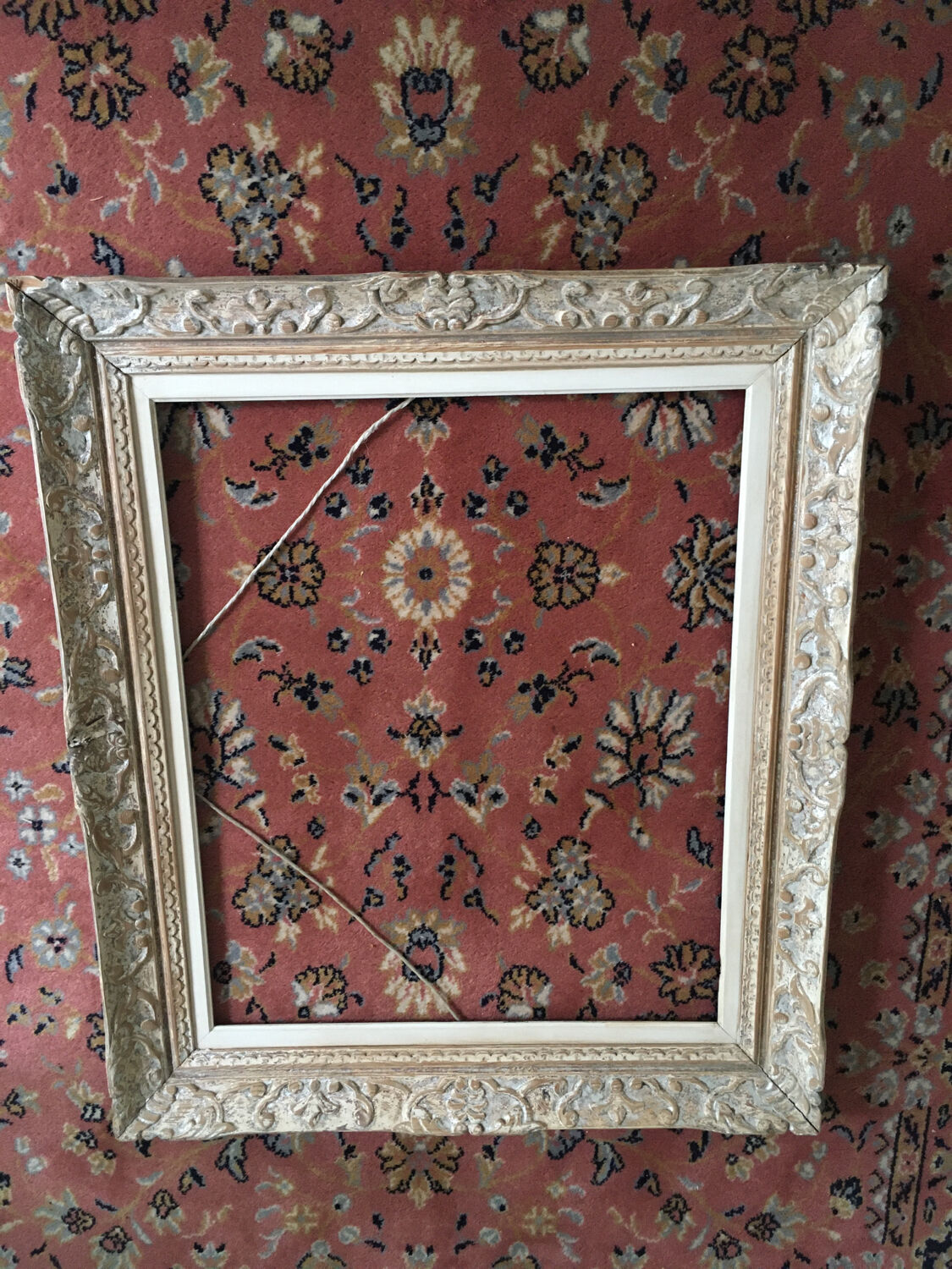 Carved wood frame.