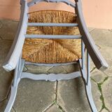 Provencal style straw armchair with gray blue patina armrests