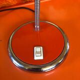 Orange articulated desk lamp