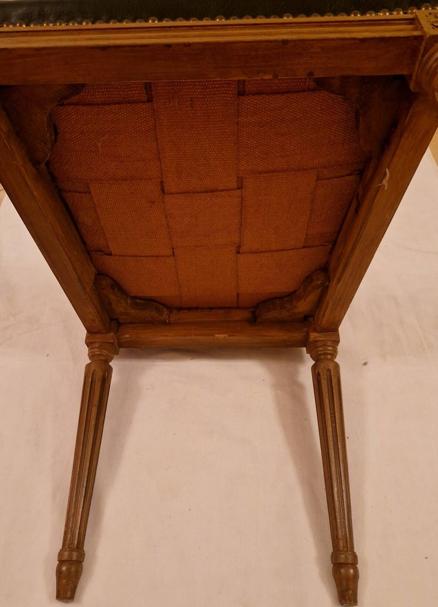 Antique Louis XVI style chair in solid wood and patinated leather.