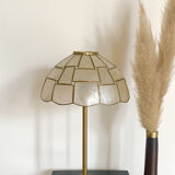 Table lamp with a lampshade with mother-of-pearl set with checkerboard brass and a gilded foot