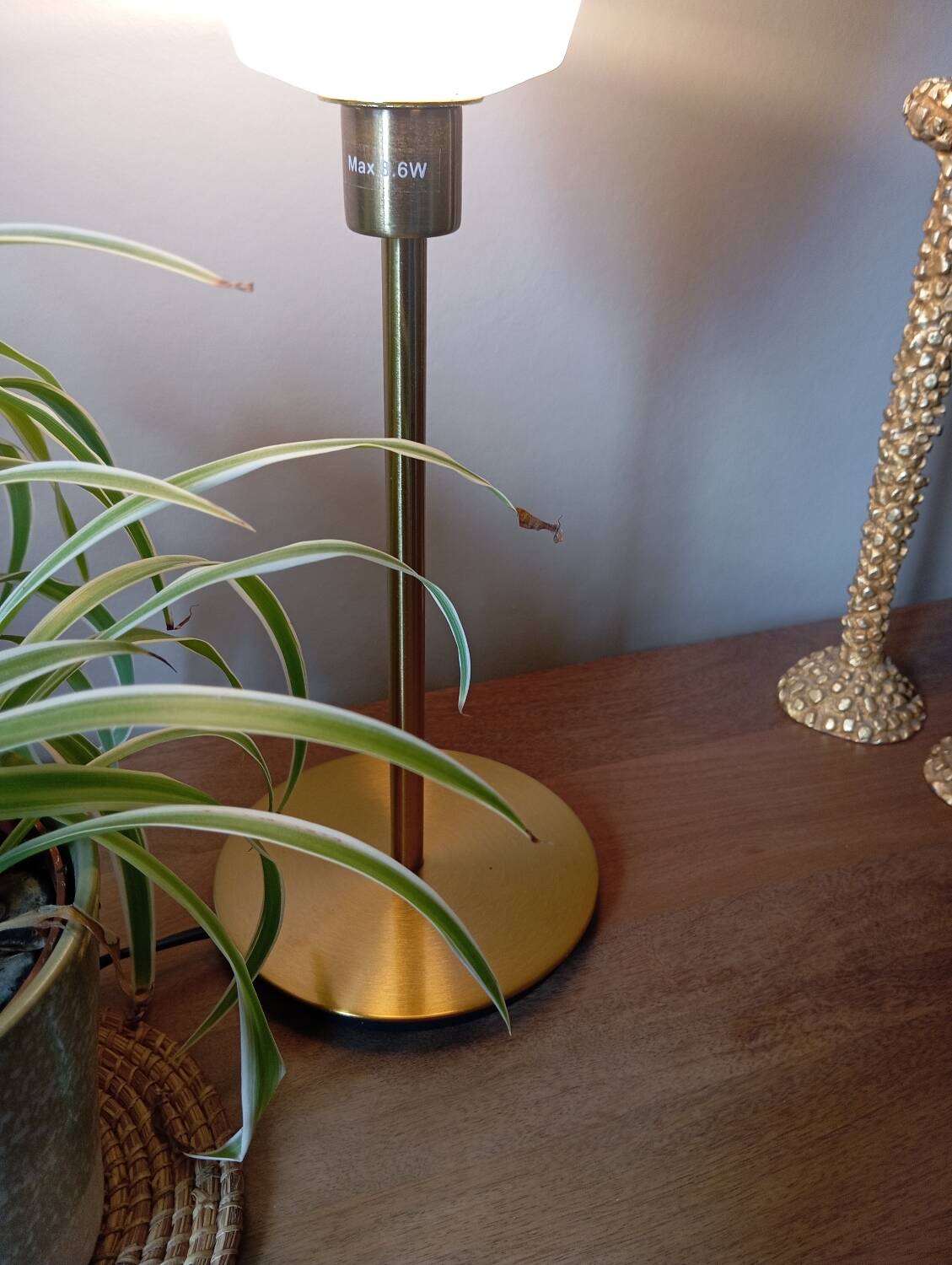 Mid-century gold metal table lamp with white striped shade