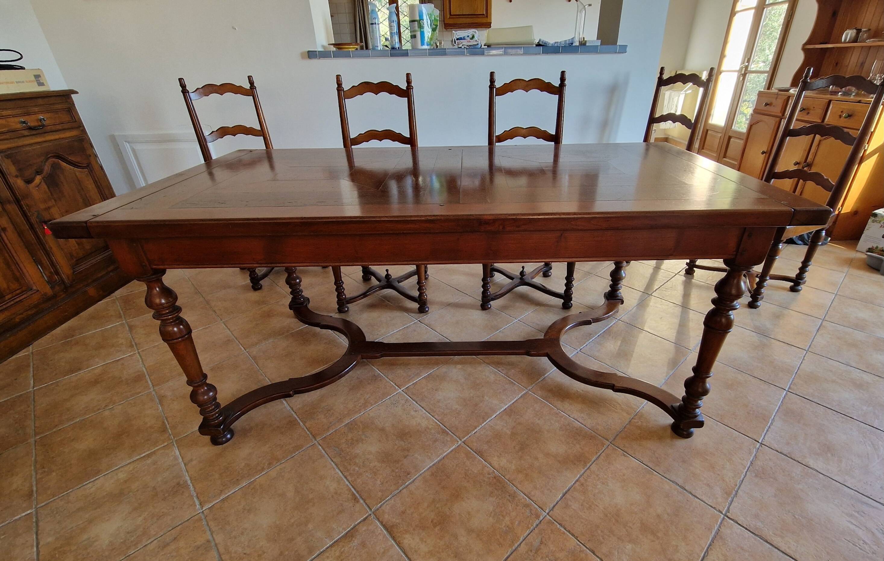 Marquetry wooden dining table with its 6 chairs.