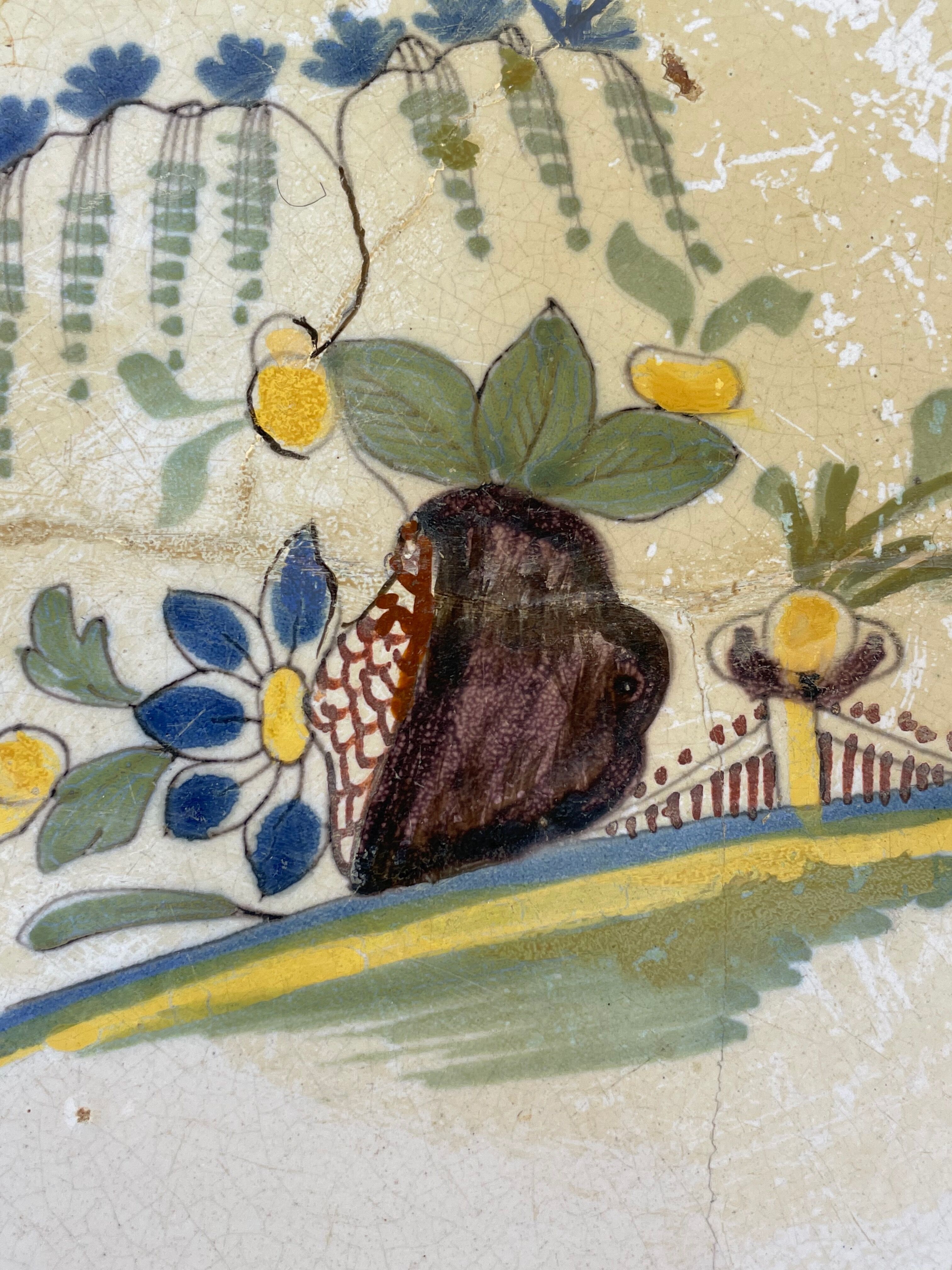 Restored antique dish with floral motif