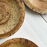 3 rustic stoneware plates, brown and beige speckled finish.