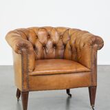Fauteuil chesterfield sur roulettes en cuir de mouton
