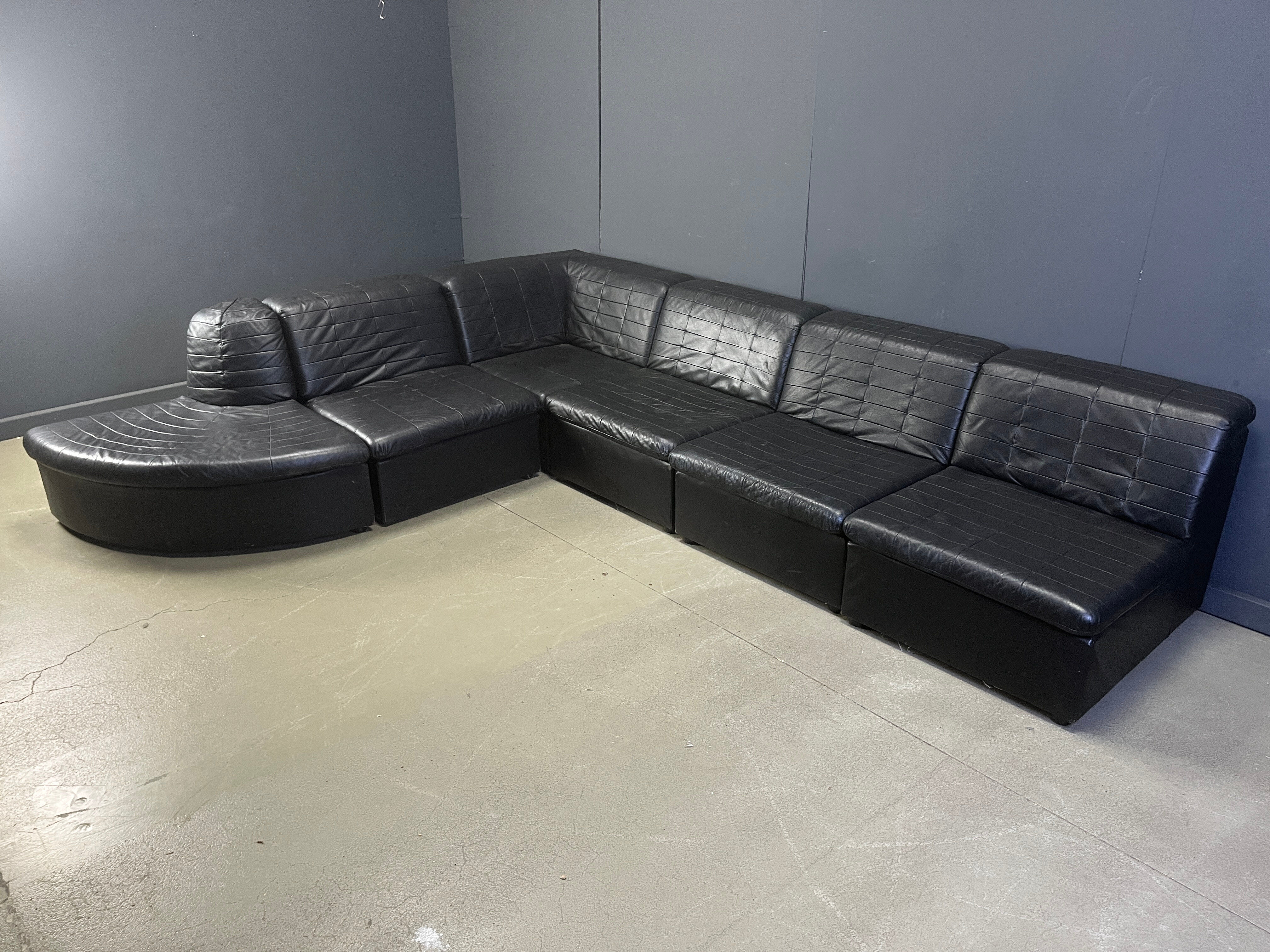Vintage black patchwork leather modular sofa set by Laauser, 1970s