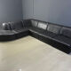 Vintage black patchwork leather modular sofa set by Laauser, 1970s