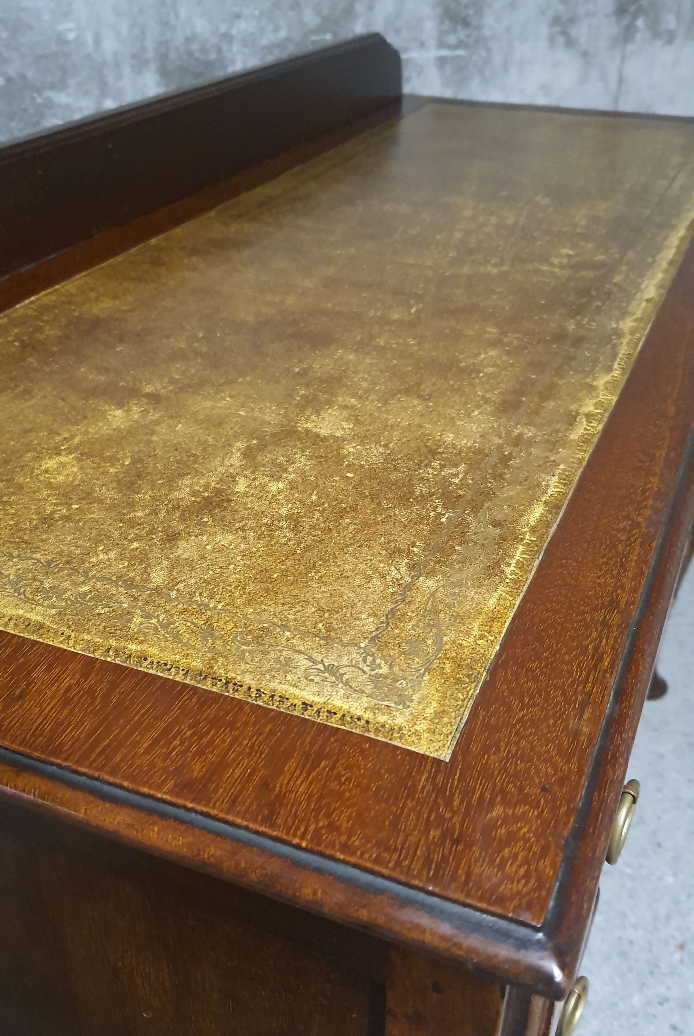 Old desk in cherry and green leather