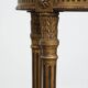 Antique French round side table in golden colour with a marble top.