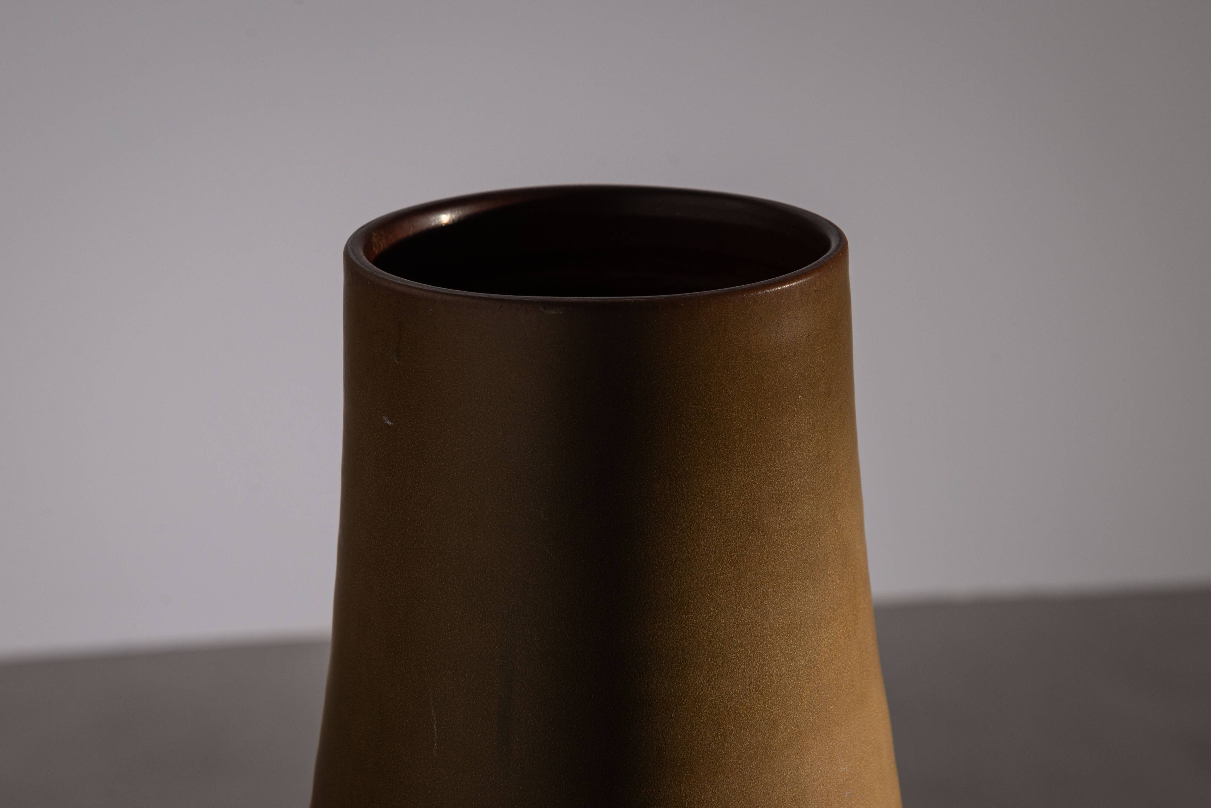 Minimalist curved stoneware vase in matte sand finish