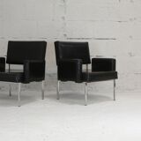 Pair of stainless steel, black leather-like armchairs, France, circa 1970
