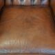 Brown leather wingback Chesterfield armchair