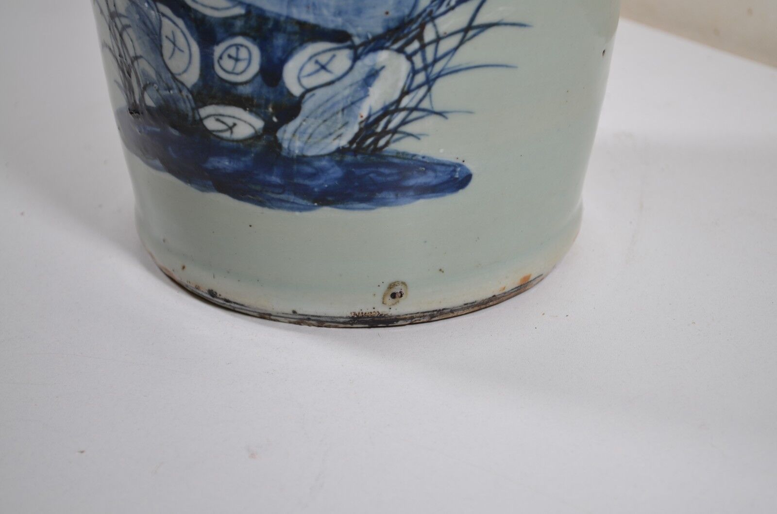 China. Porcelain mallet vase with blue and white phoenix decoration on a rock.
