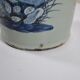 China. Porcelain mallet vase with blue and white phoenix decoration on a rock.