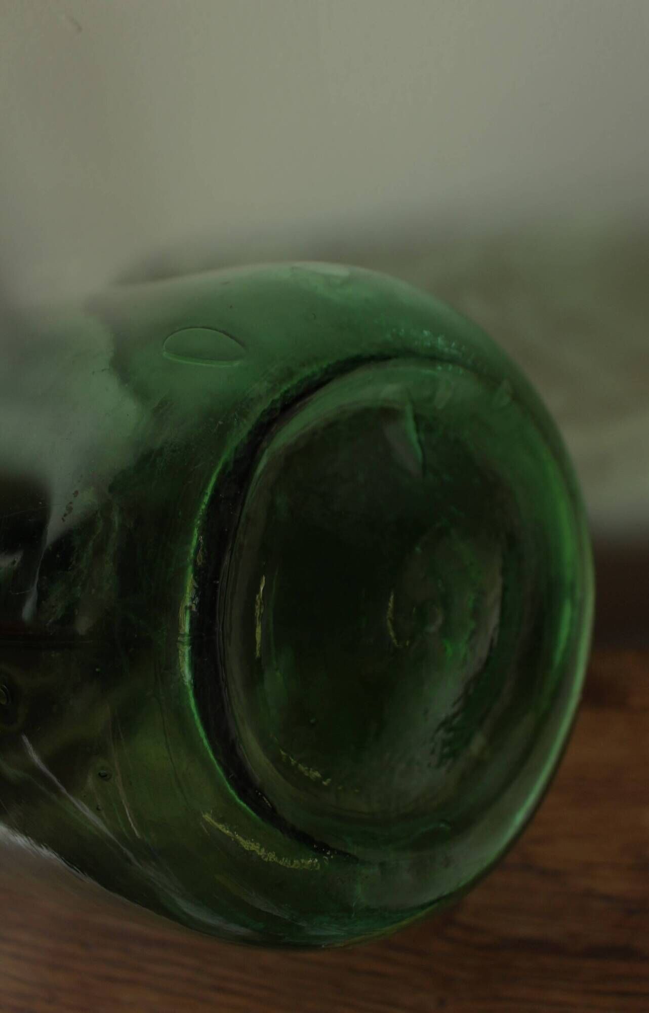 Dame Jeanne carboy from the Viresa collection in dark green glass