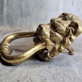 Gilded bronze door knocker in the shape of a lion's head