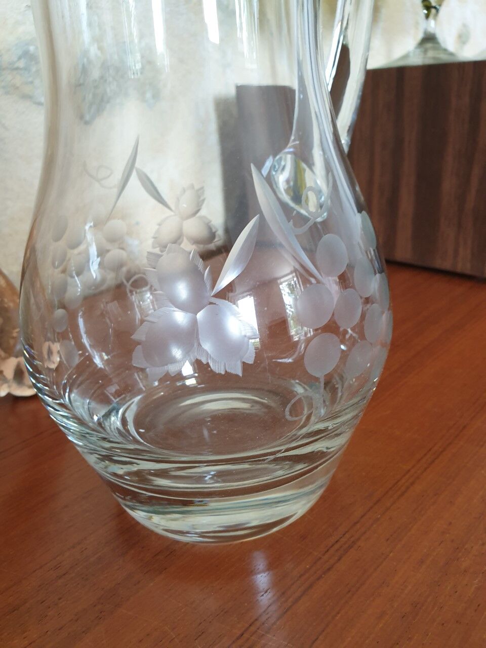 Pitcher decorating grape bunch