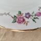 Lot de 12 assiettes creuses l'amandinoise frise dorure et roses anciennes. en demi-porcelaine poreyl
