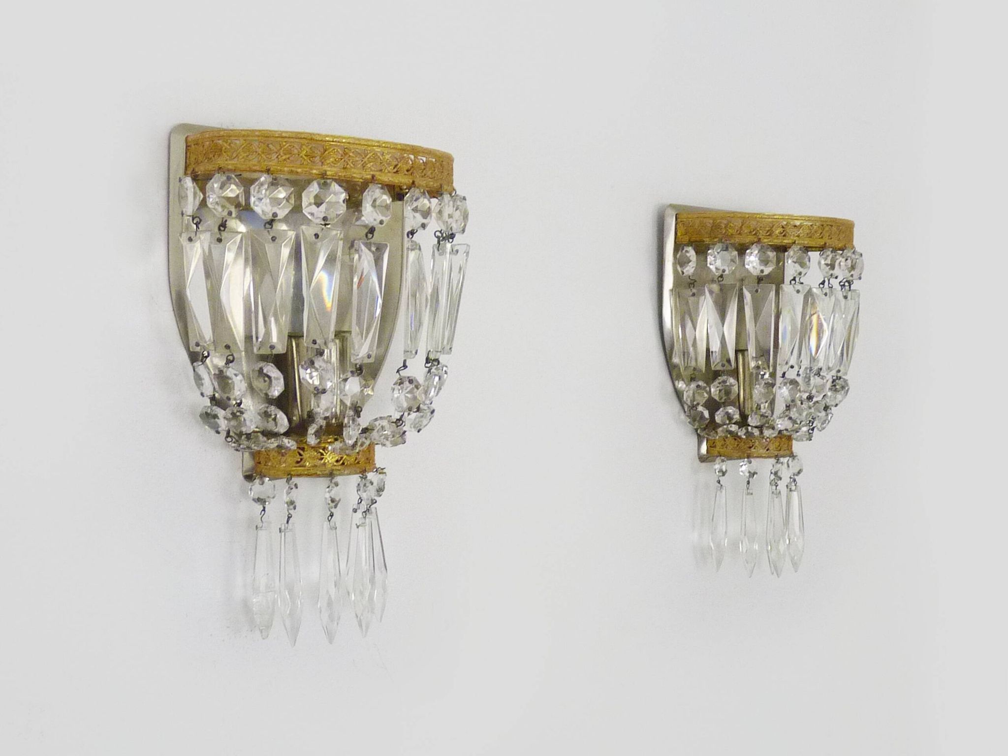 Pair of vintage bronze basket wall lights with glass pendants. The 50's