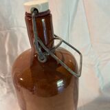 Old bottle in sandstone with a mechanical porcelein cap