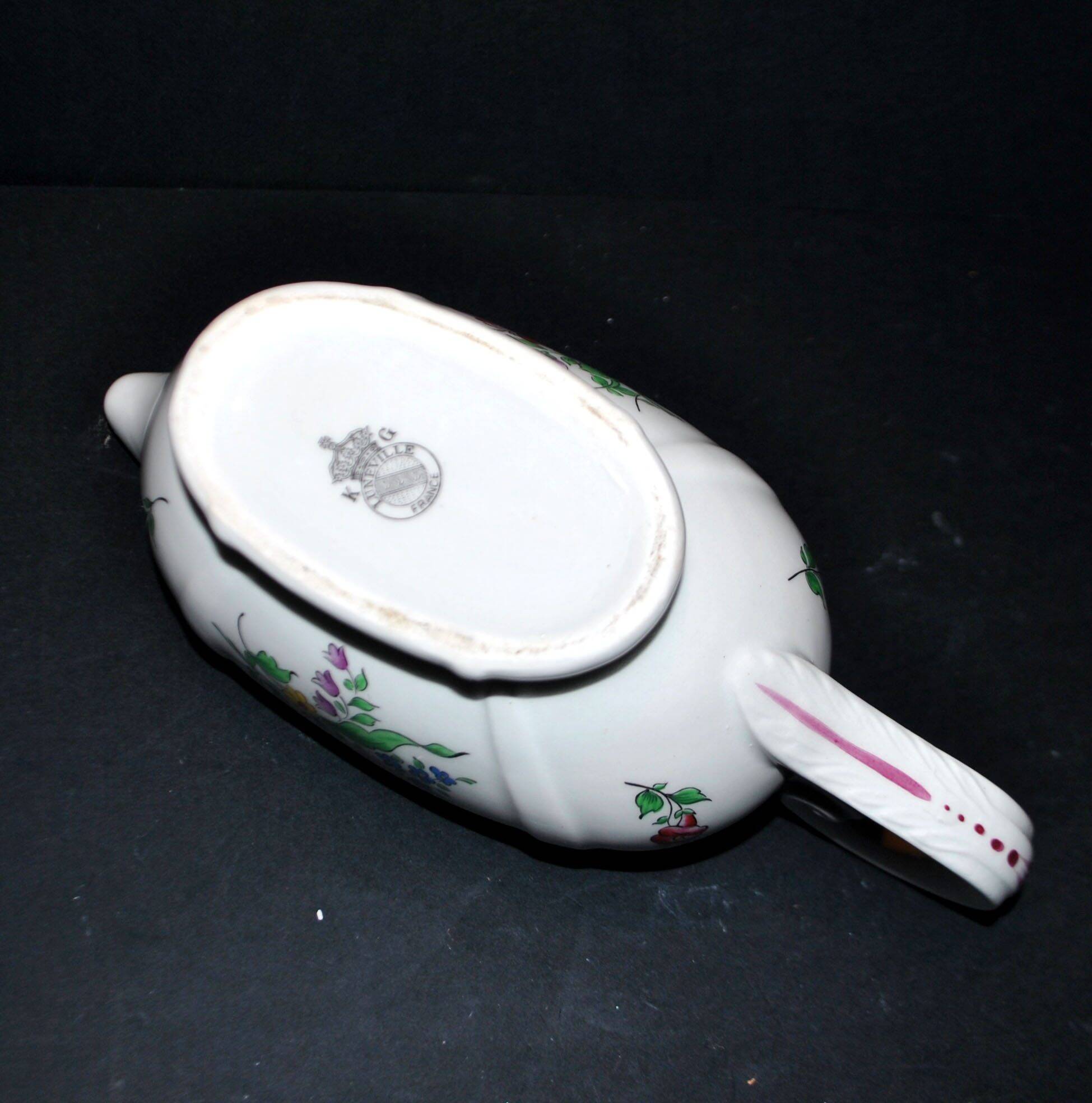 Lunéville KG earthenware sauce boat with polychrome painted flowers, revolving lamp.