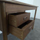 Scandinavian teak desk with a suspended drawer unit.