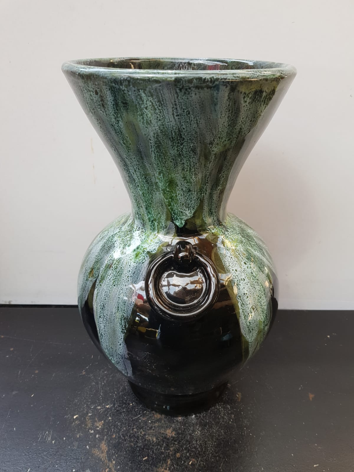 Old black enamelled ceramic Gaubier vase with green white vintage drips