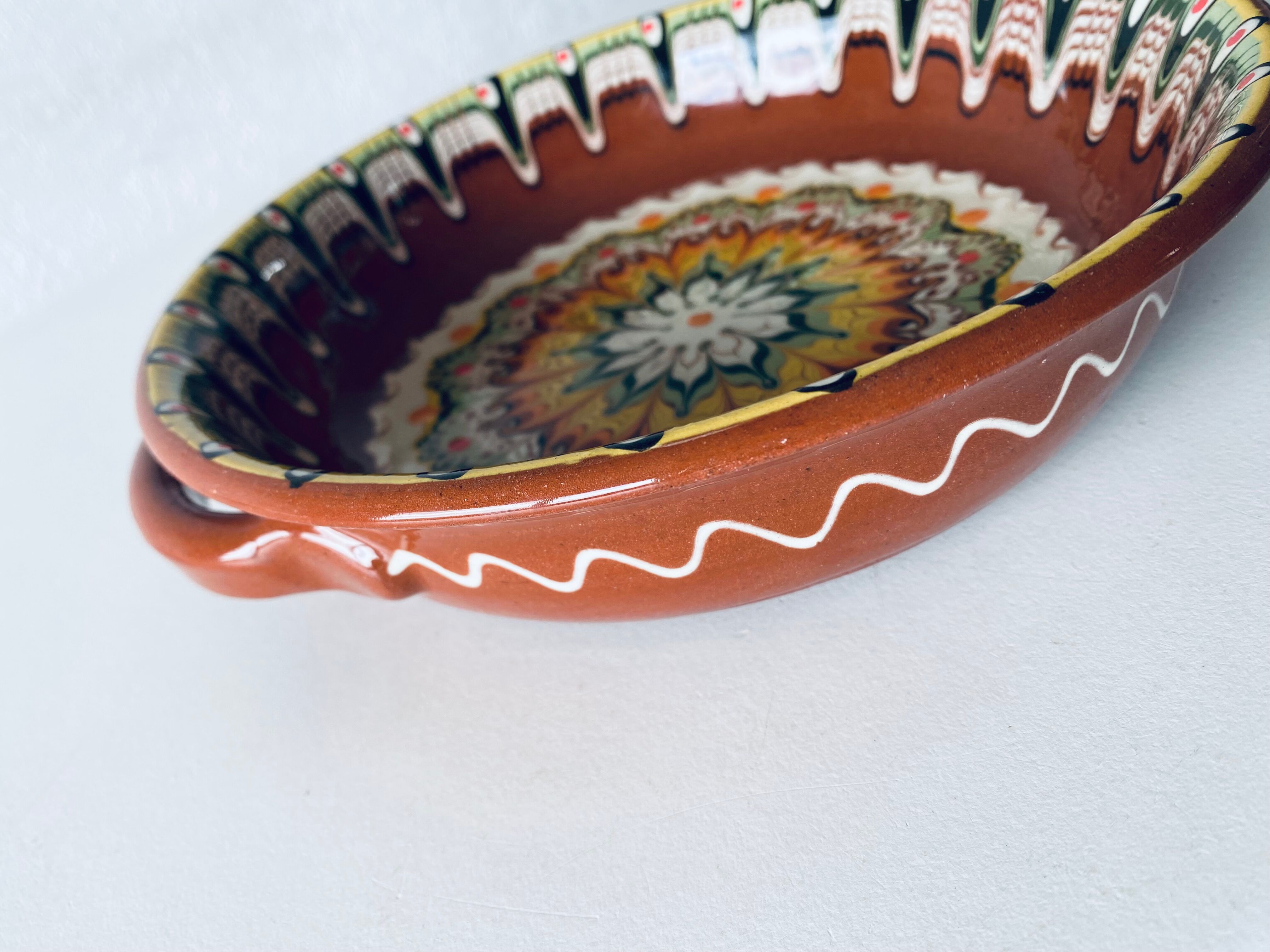 Colorful terracotta dish or salad bowl