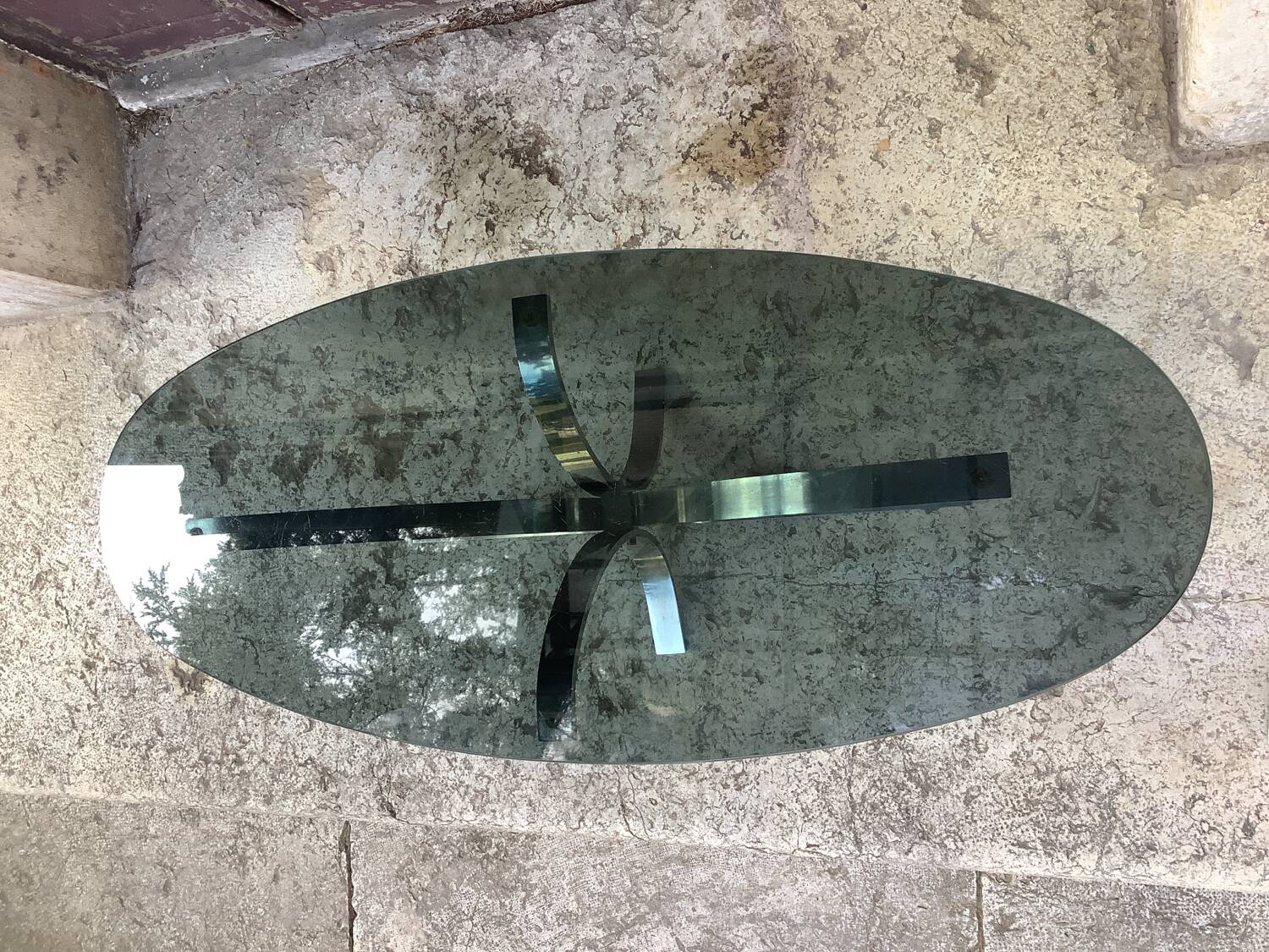 Oval smoked glass coffee table from the 70s