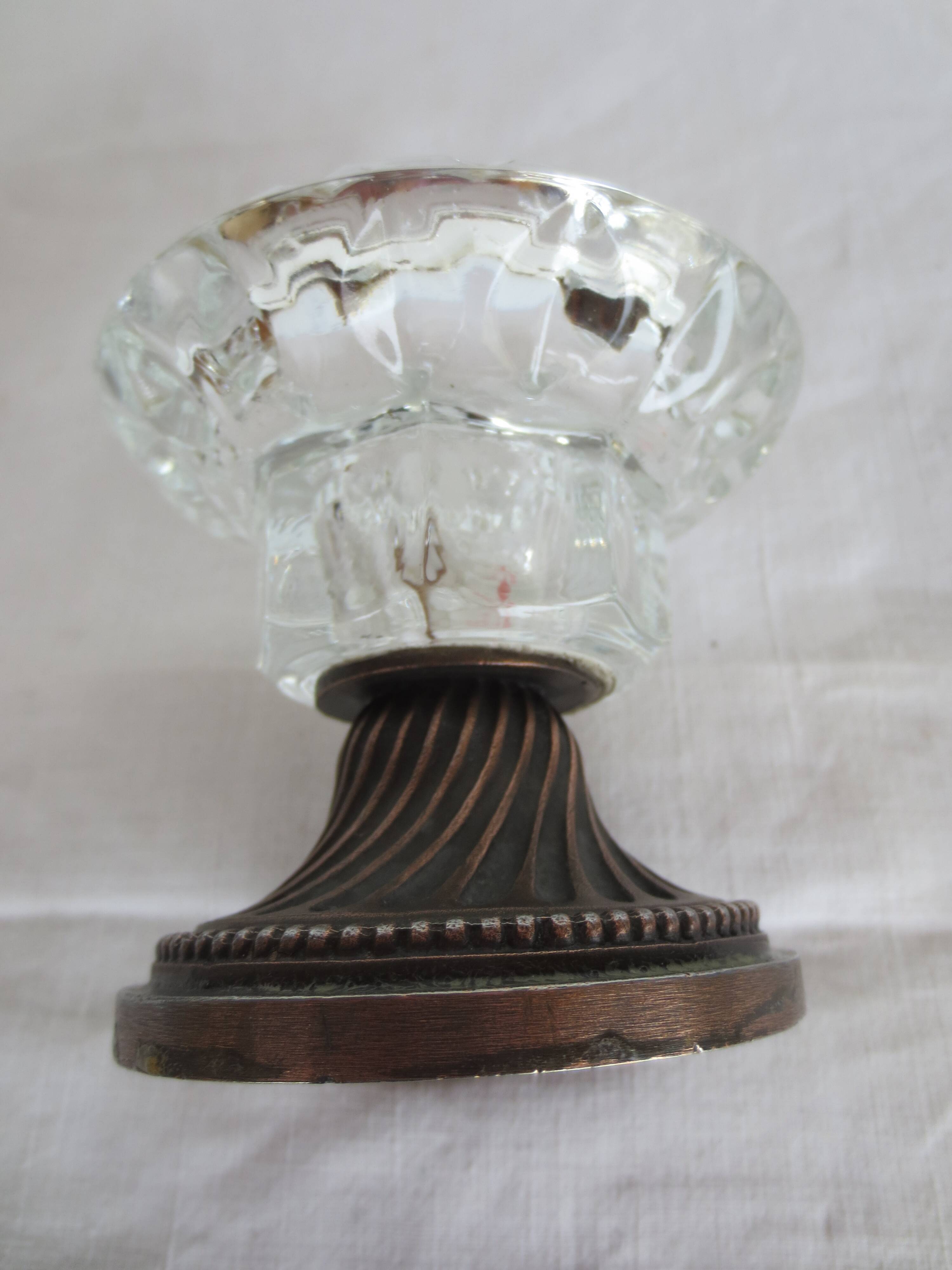 Two candle holders in bronze and crystal