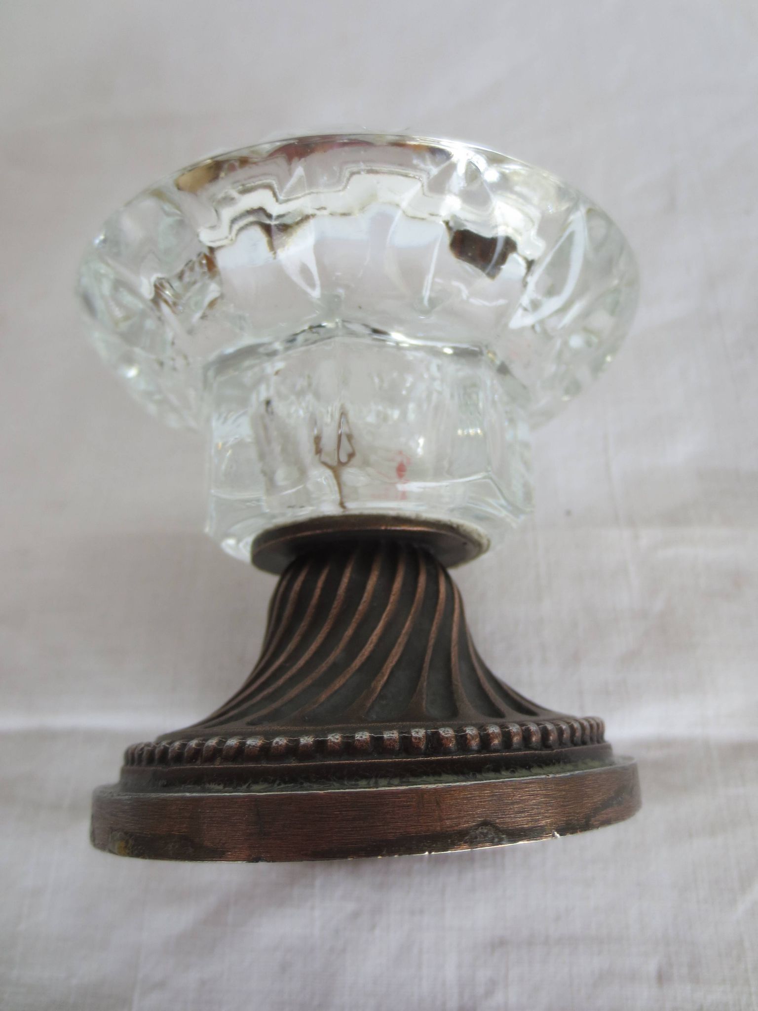 Two candle holders in bronze and crystal