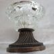 Two candle holders in bronze and crystal
