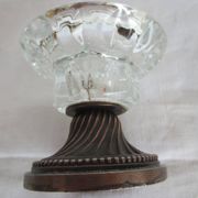 Two candle holders in bronze and crystal