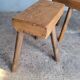 Pair of low stools in old patinated solid wood