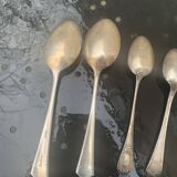 Set of 9 mismatched small spoons in silver metal, 7 small and two medium, art deco
