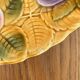 Round earthenware dish decorated with fruit in Sarreguemines slipware