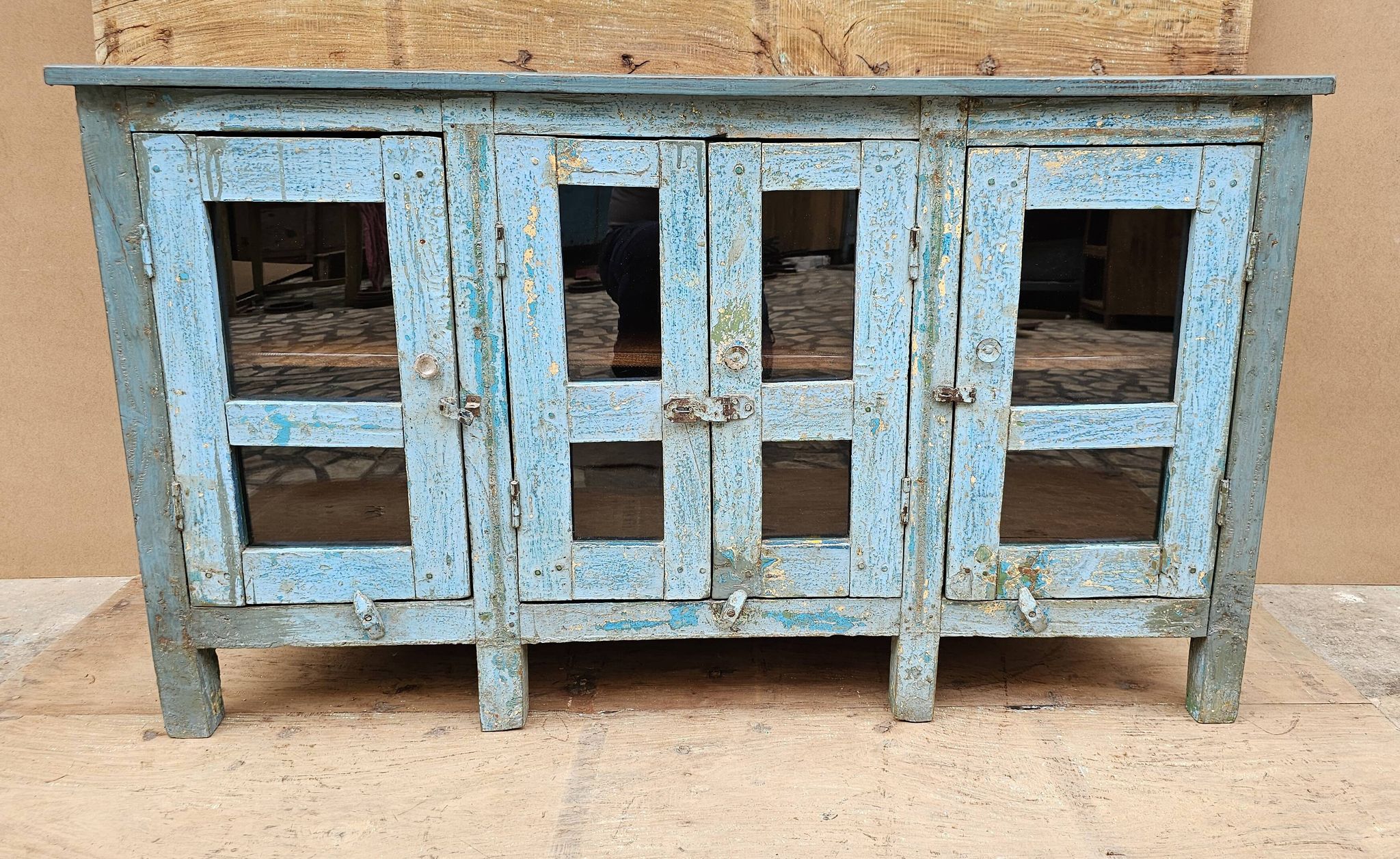 Antique glass-fronted buffet in Burmese teak