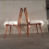 Pair of vintage Scandinavian Hygge chairs in solid wood and synthetic Mongolian sheepskin seat