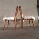 Paire de chaises scandinaves vintage Hygge bois massif et assise mouton de mongolie synthétique