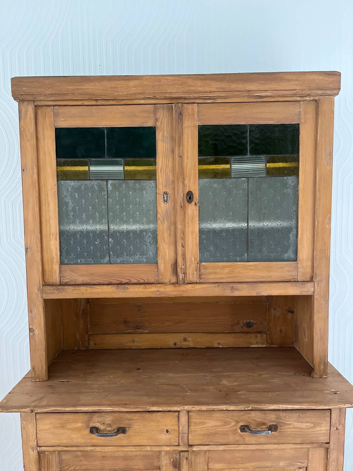 Antique dresser with glass doors and fleur-de-lys from the 50s