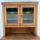Antique dresser with glass doors and fleur-de-lys from the 50s