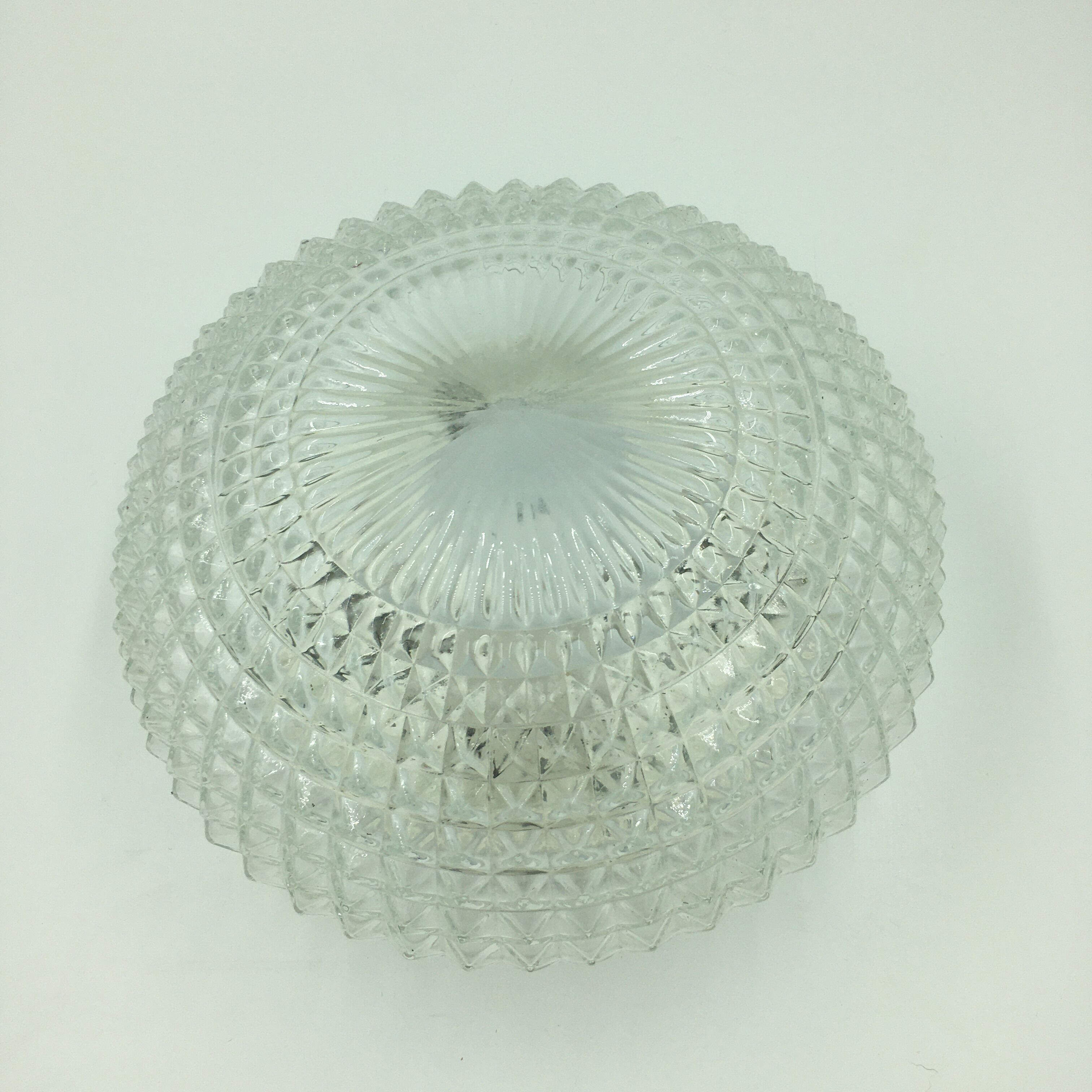 Ceiling lamp in molded glass in relief