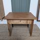 Small antique wooden coffee table with drawer, country style.
