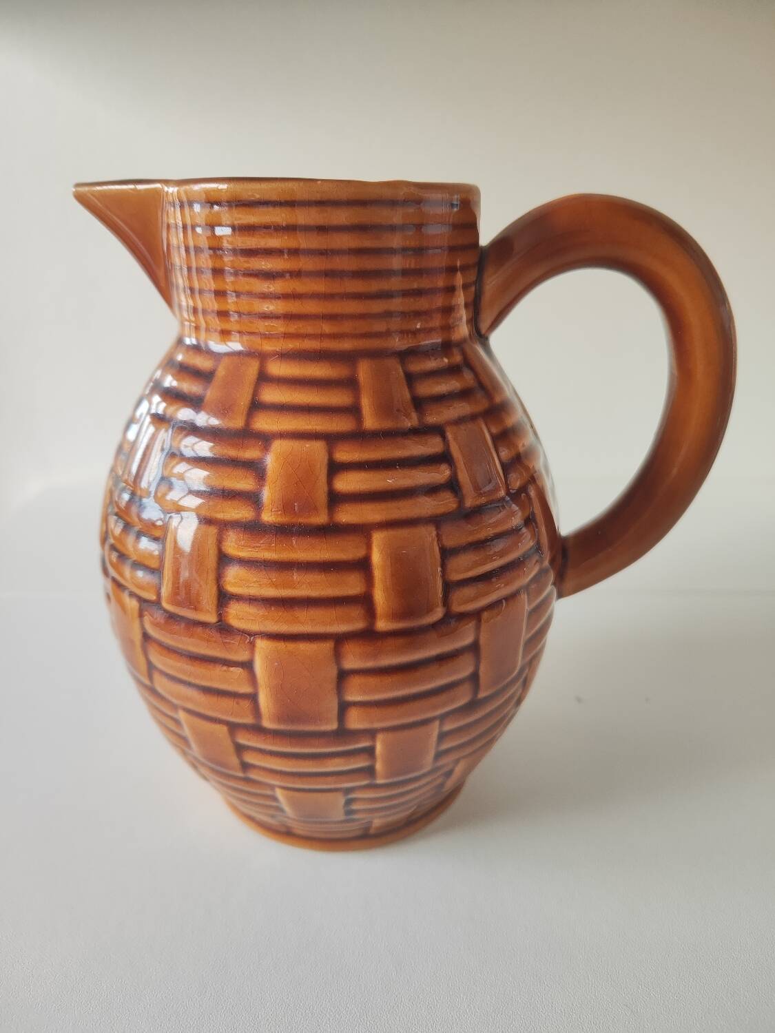 Caramel brown pitcher in glazed ceramic with barbotine finish from the 60s
